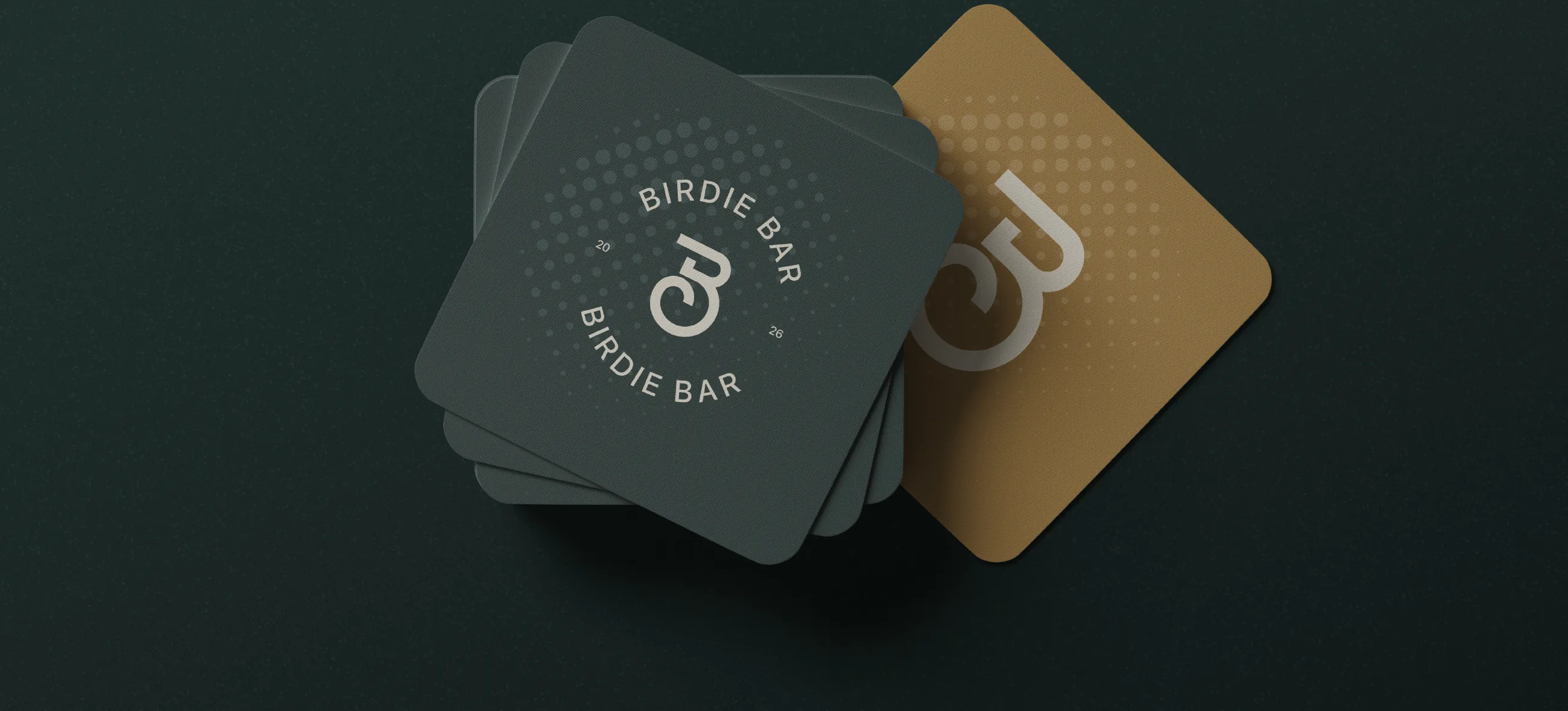 Birdie Bar coasters in green and sand with the round seal and the monogram
