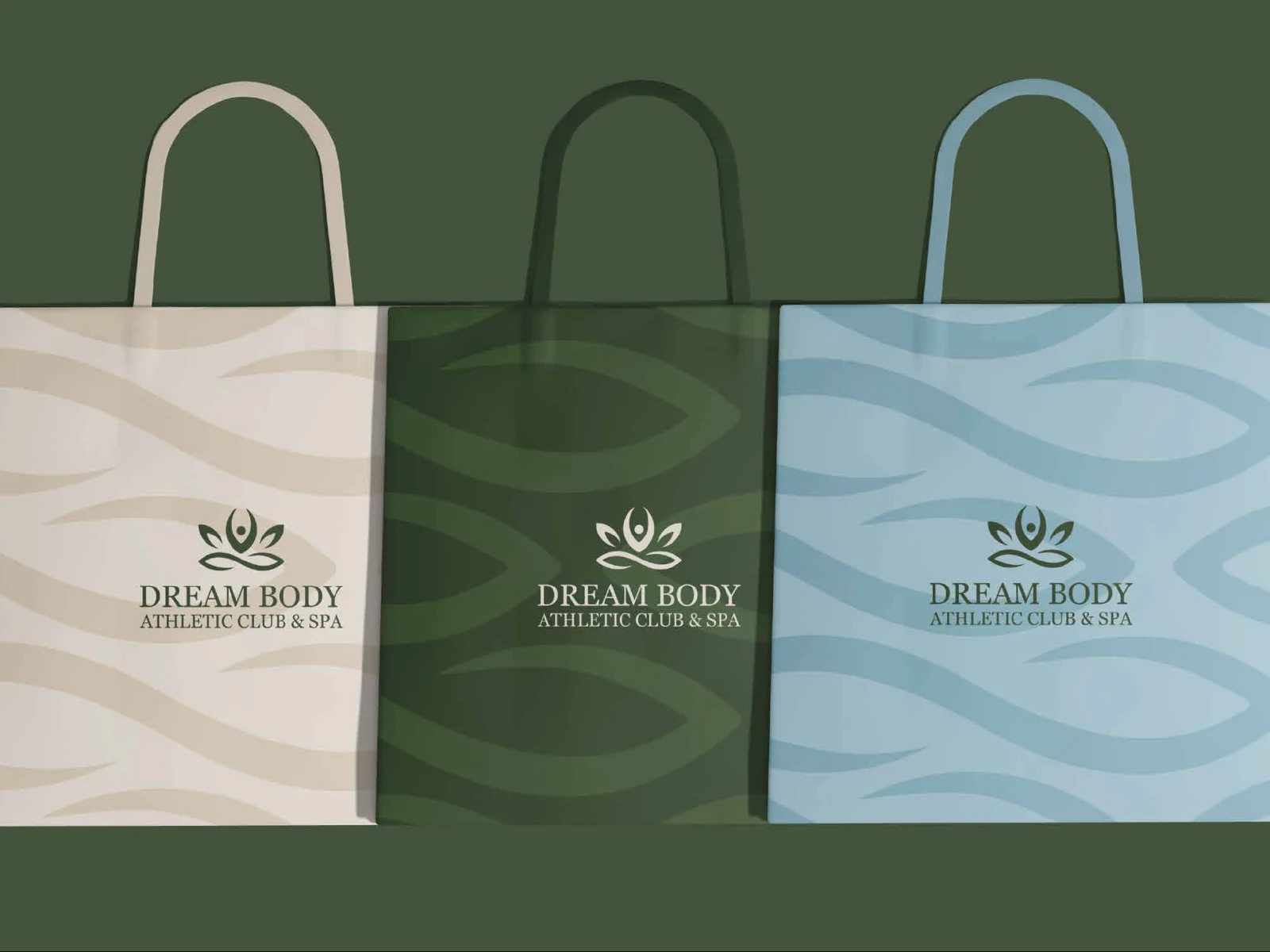 Three Dream Body shopping bags in cream, dark green and pale blue with the wave pattern