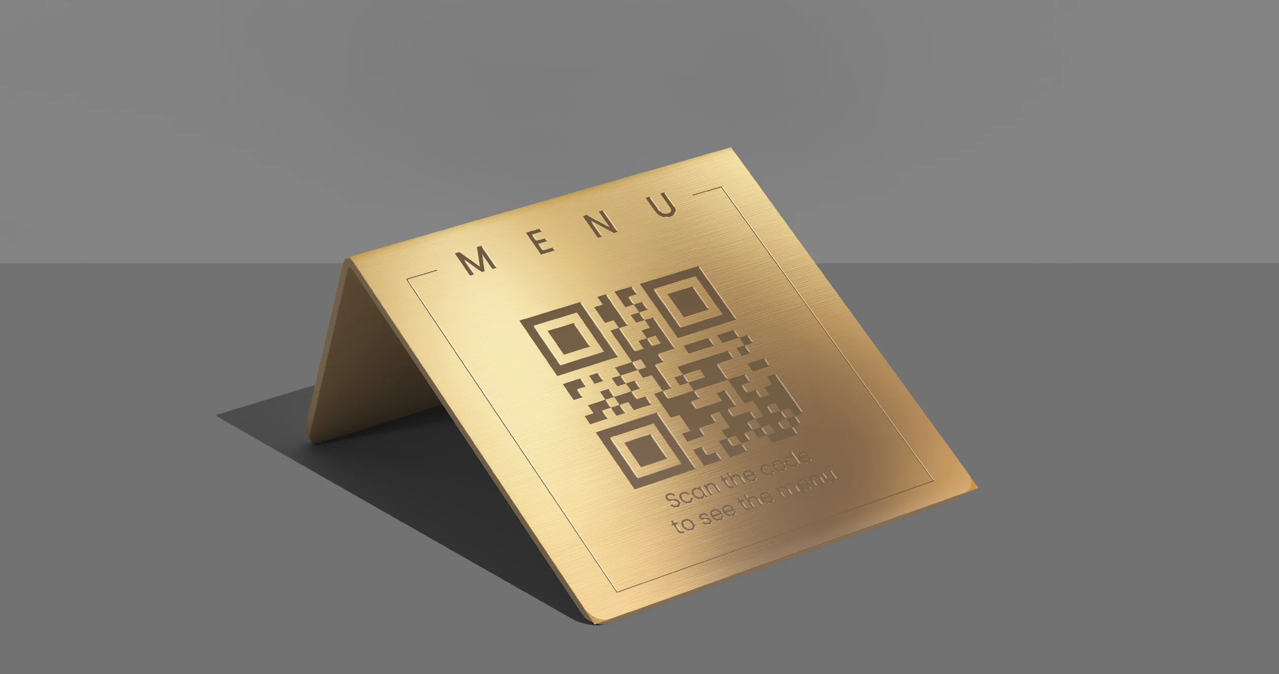 A gold table tent menu with a QR code