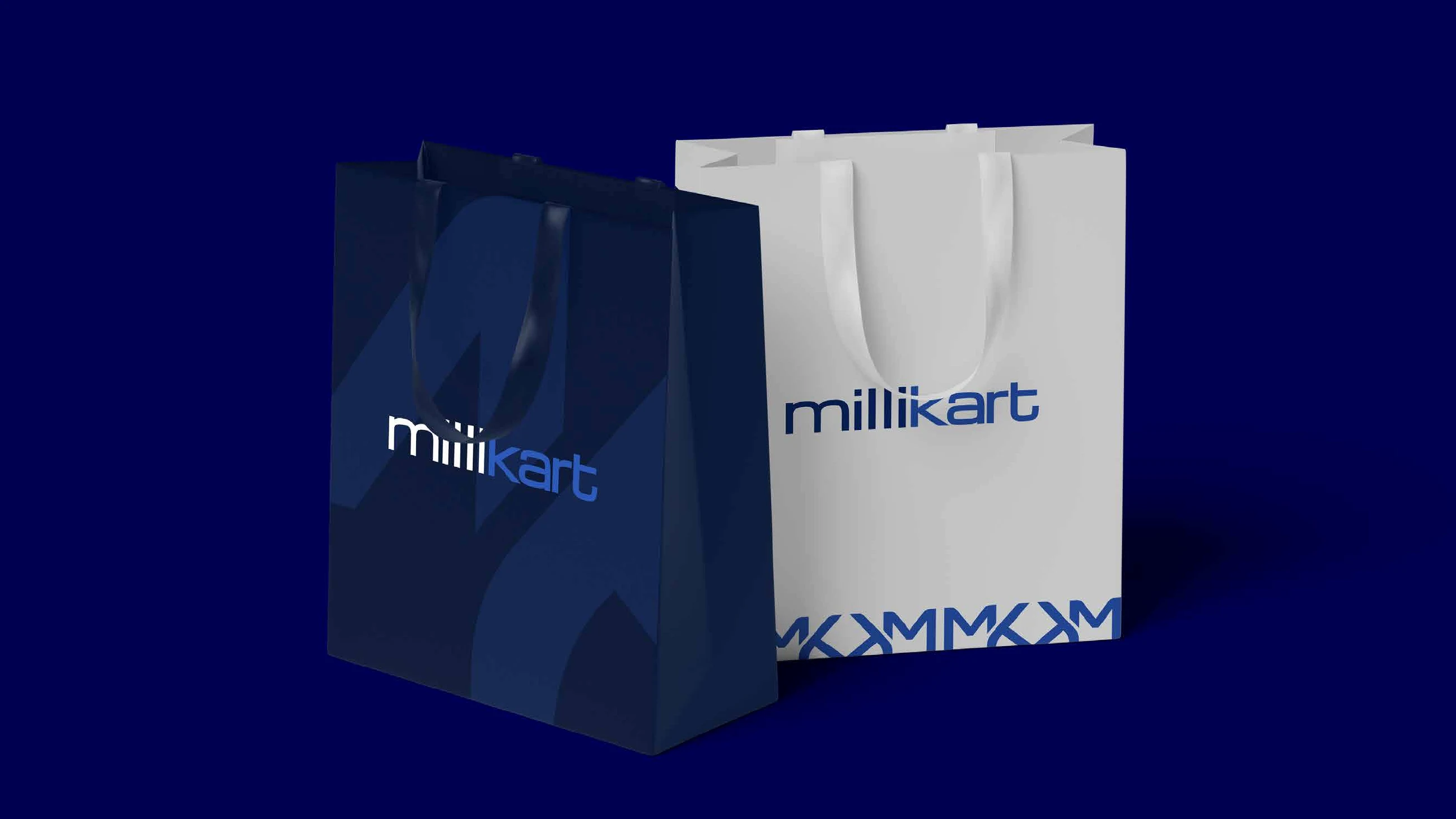 Millikart shopping bags in navy and white with the wordmark and the monogram band