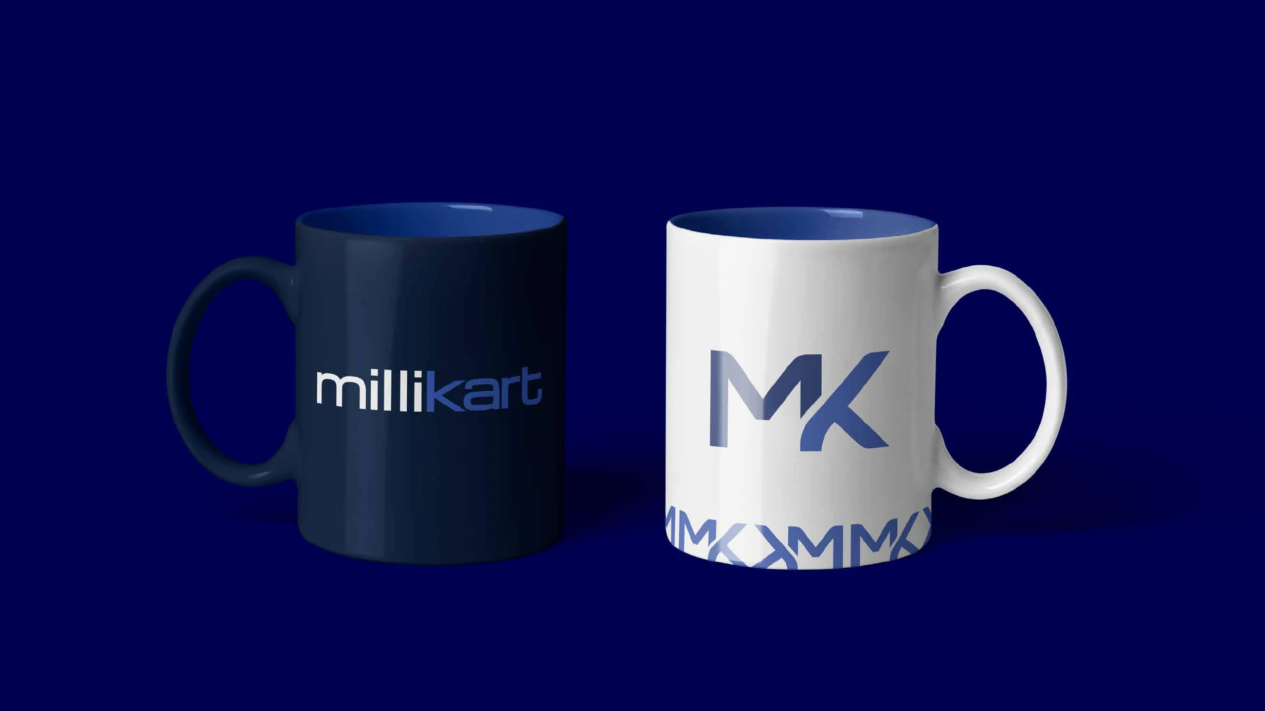 A navy mug with the Millikart wordmark and a white mug with the MK monogram