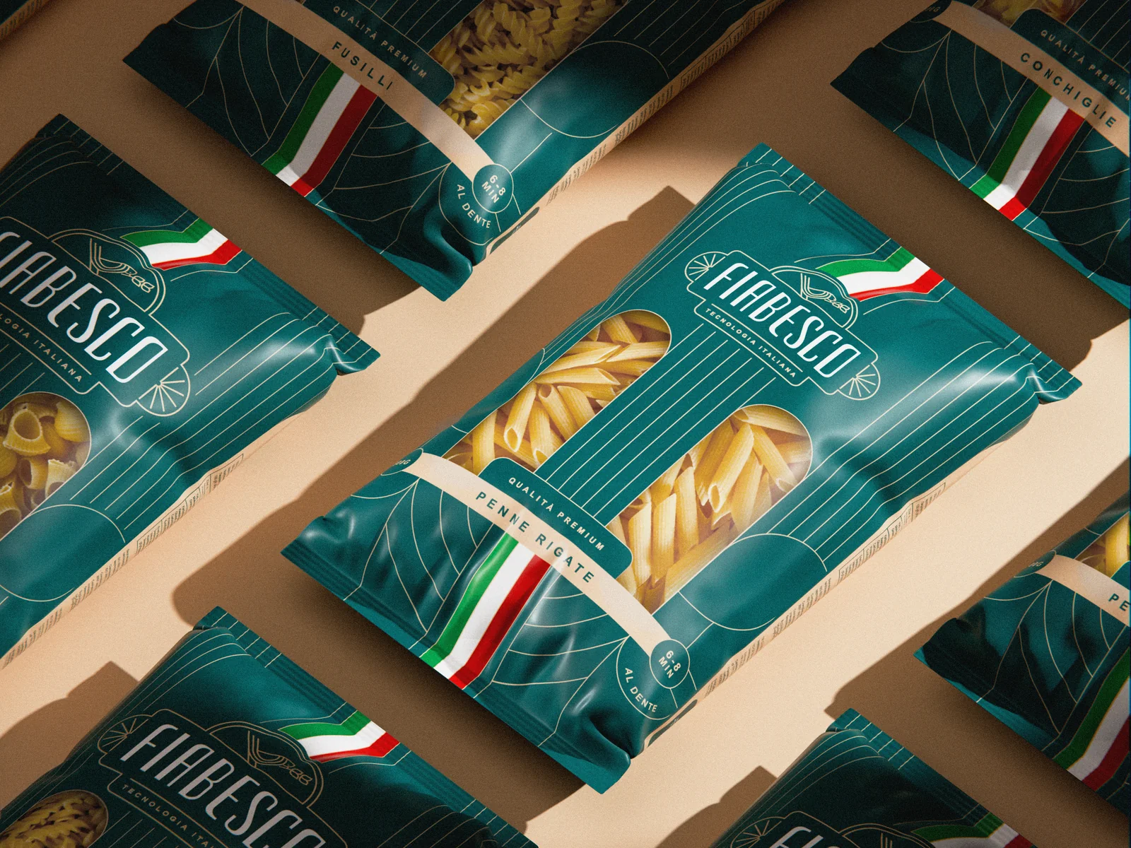 Rows of teal Fiabesco penne packs with the Italian stripe, laid diagonally
