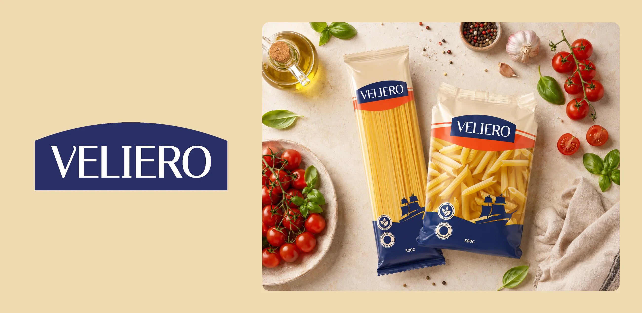 The Veliero logo beside spaghetti and penne packs among tomatoes and basil